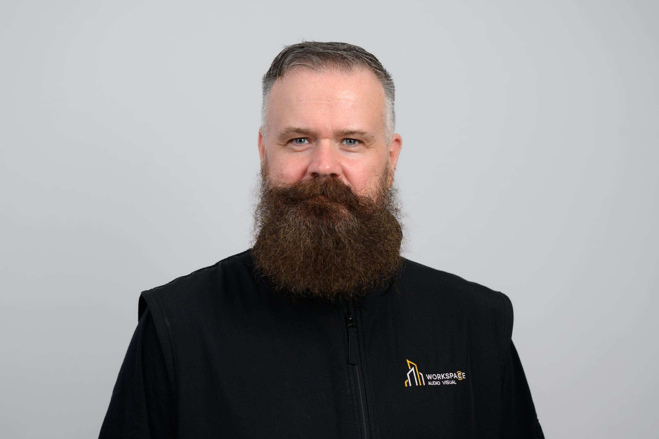 man with a beard wearing a black jacket